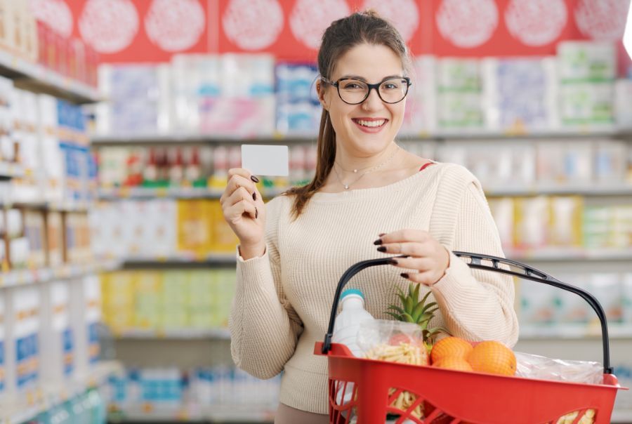 A woman holding a discount card