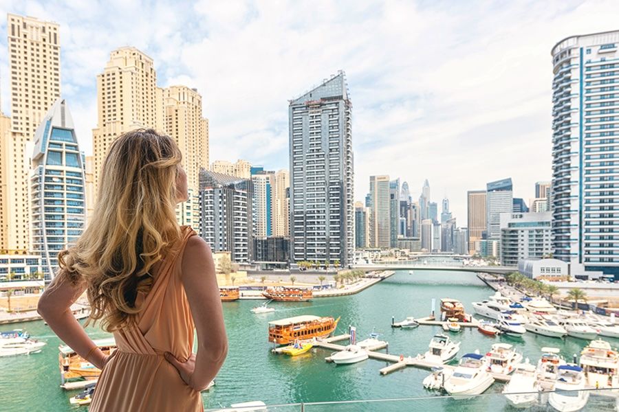A woman looking at the apartments in Dubai Marina