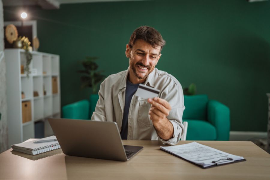 An entrepreneur holding a discount card