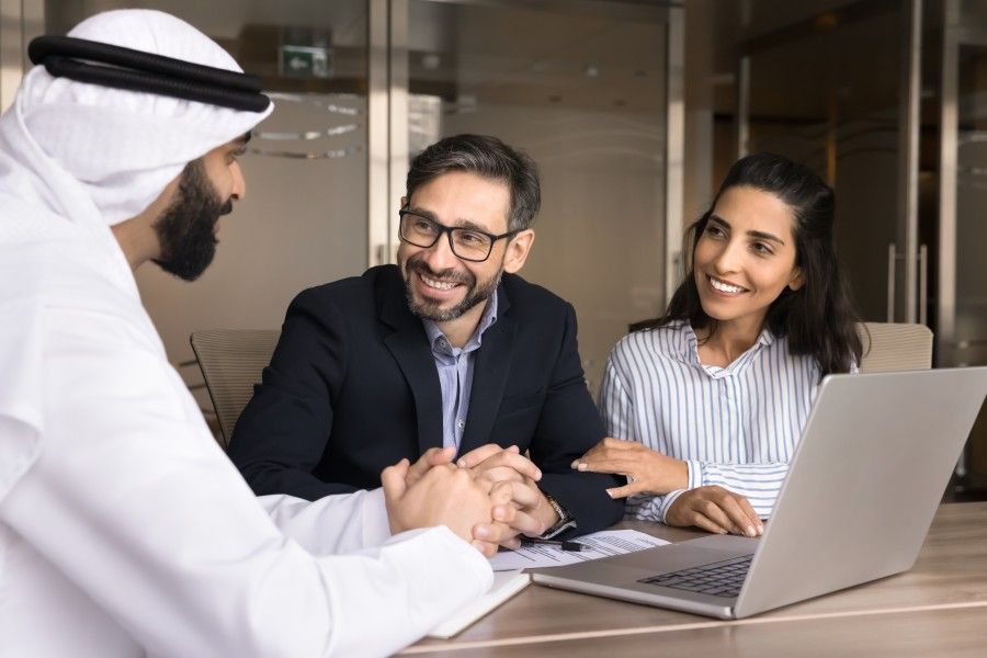 A couple getting real estate guidance from an agent