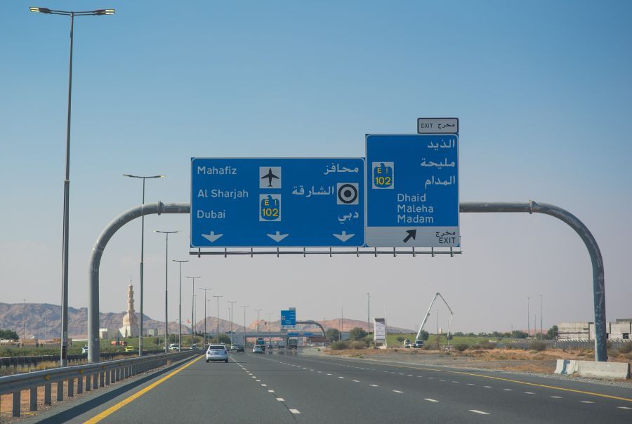 RAK road with sign to Dubai